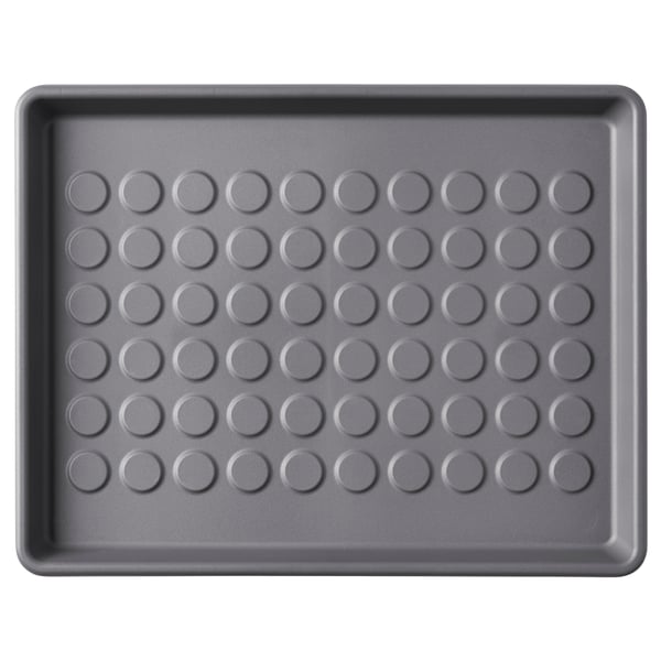 Grey rectangular BAGGMUCK mat, perforated circles, high edges, recycled polypropylene.