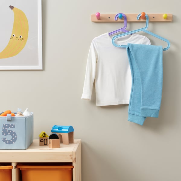 Kids room with toys and clothes.