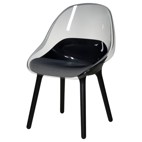 A BALTSAR chair. Its clear, modern, with a curved seat and back. The legs are black beech wood. It has a black cushion.