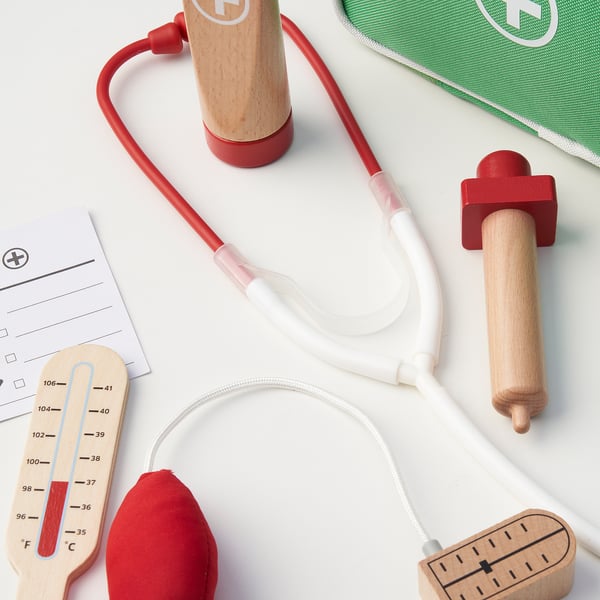 Wooden medical play set with stethoscope, thermometer, syringe. Encourages imaginative play, empathy, communication.