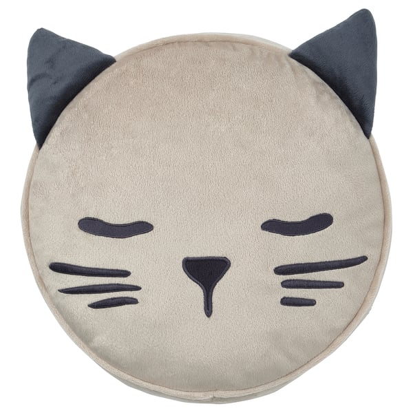 Round grey cat-shaped pillow with black eyes, mouth, ears, and nose. Soft, concealable pocket on back.