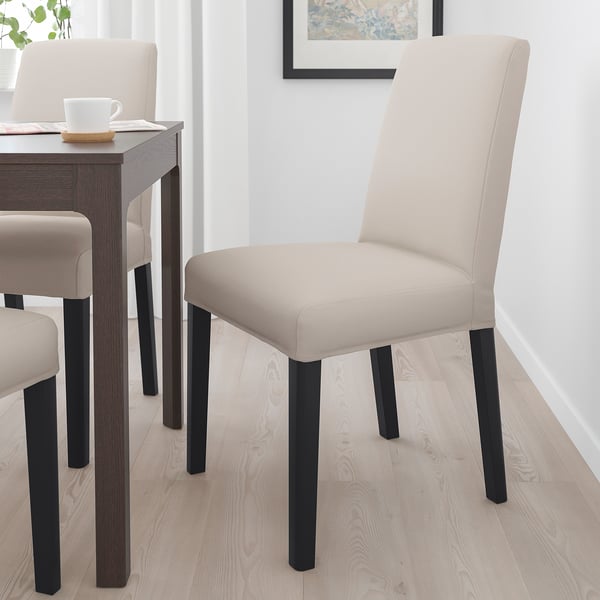 Modern dining chair, beige fabric, black legs, medium size, high back, fits neatly under table.