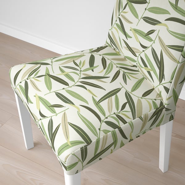 A chair with a tropical leaf pattern on its cover, showcasing high-quality design and comfort.