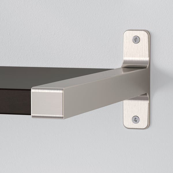 Metal bracket supporting dark shelf. High-quality, secure wall-mounted display.