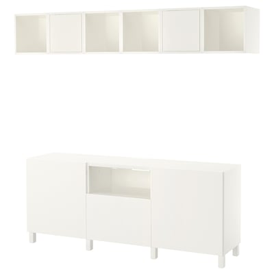 This image shows a white BESTÅ tv storage unit. It a combination of open and closed storage with a sleek, modern design.