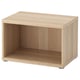 A light oak BESTÅ storage unit with an open space, made of particleboard and honeycomb paper filling, featuring a minimalist and modular design.