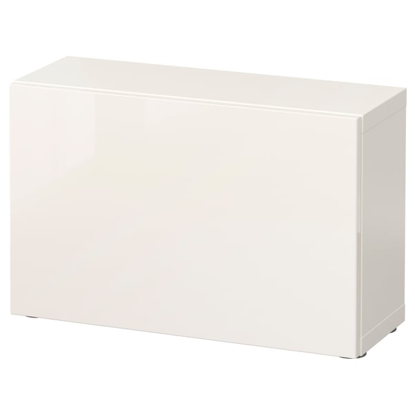 A white BESTÅ storage unit, rectangular in shape. It has a sleek, modern design with a smooth finish.