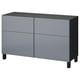 A gray ikea BESTÅ sideboard with four drawers and two doors. It has a sleek, modern design with a dark top and legs.