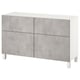 A BESTÅ sideboard in white with four gray textured doors, supporting square legs. It combines modern design and functional storage.