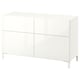 White BESTÅ cabinet, modern design, four doors, two shelves, metal legs.