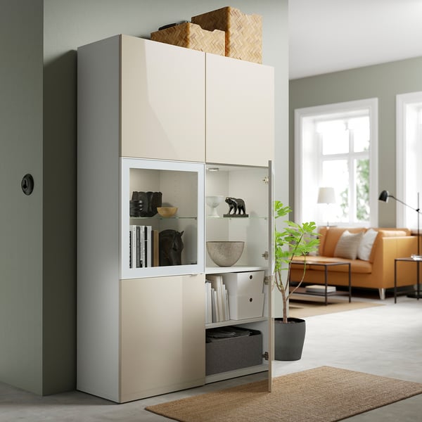 Large storage unit with glass doors showcasing decor and hidden storage. Soft-close and push-open.