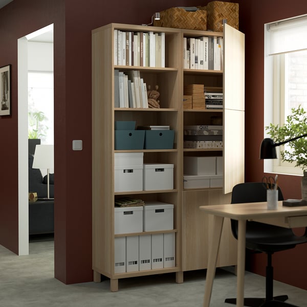 Bookshelf with adjustable shelves and storage boxes.