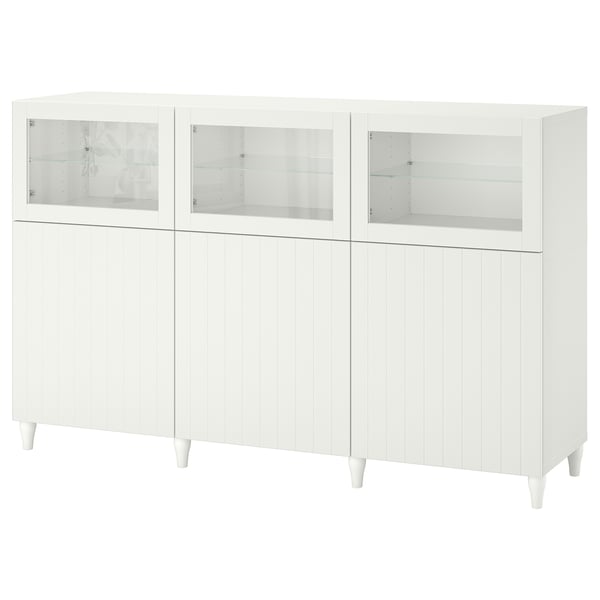 A white BESTÅ sideboard with glass doors and cabinet storage, featuring a sleek design and adjustable shelves.