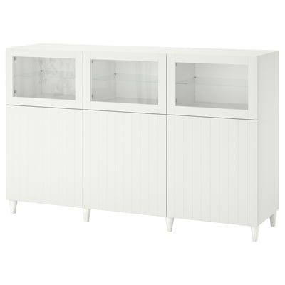 A white BESTÅ sideboard with glass doors and cabinet storage, featuring a sleek design and adjustable shelves.