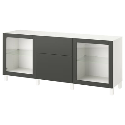 Modern BESTÅ cabinet in white & black with glass doors, offering adjustable shelves for organised storage.