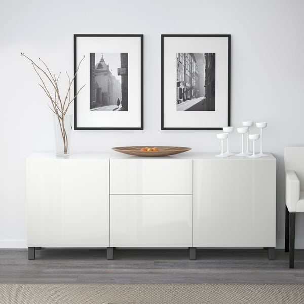 White BESTÅ storage with photos above.