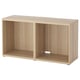 Light-colored wooden BESTÅ tv bench; open shelves, rectangular shape, minimalist design.