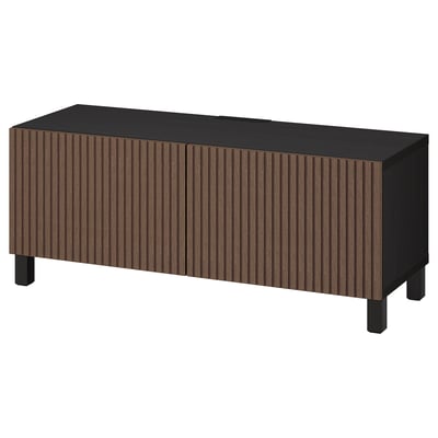 Modern black tv stand with vertical wood panels, four legs, sleek rectangular design.