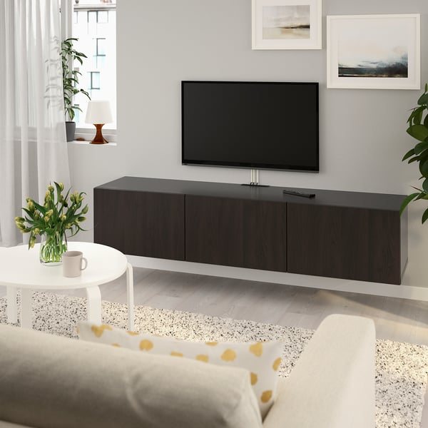 Modern living room with BESTÅ tv bench, plants, & minimalist decor.