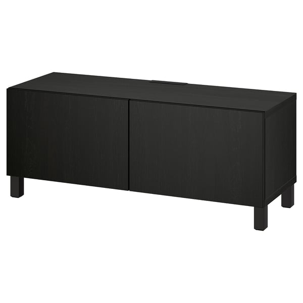 Black BESTÅ tv bench, rectangular with two doors, wooden legs.
