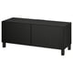 Black BESTÅ tv bench, rectangular with two doors, wooden legs.
