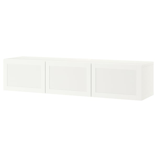 A white BESTÅ tv bench with three doors, offering storage and cable management.