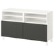 A white BESTÅ tv bench with dark gray doors. It open shelves and a modern design.