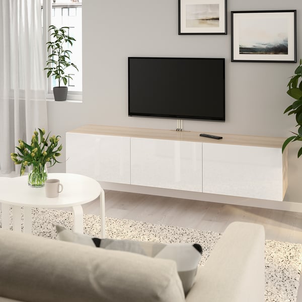 Modern living room with BESTÅ tv unit, sofa, and plants.
