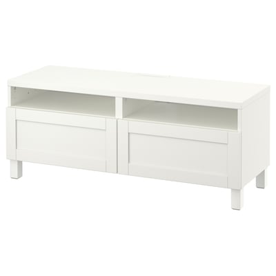 White BESTÅ tv bench two drawers, open shelf, adjustable feet, and cable management.