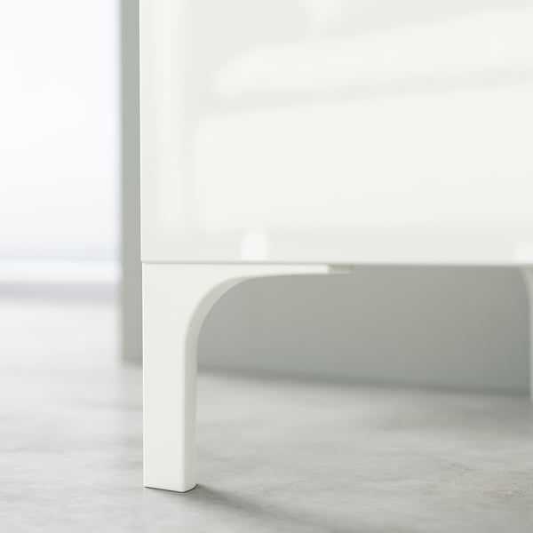 White BESTÅ furniture leg, sleek & modern, polished finish, curved design.