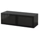 A black BESTÅ storage unit with sleek glass doors, modern design, and sturdy construction.
