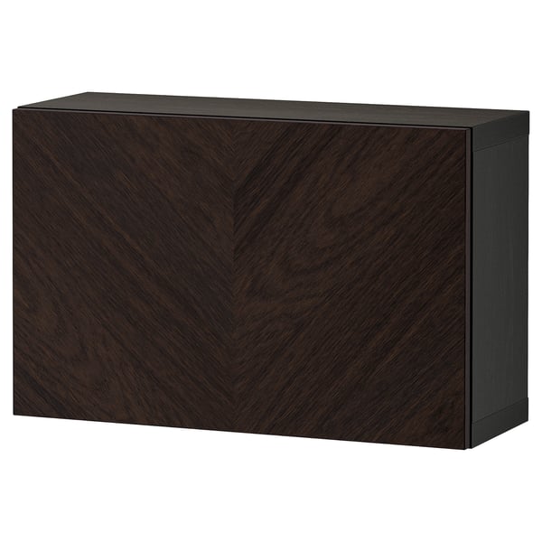 Dark brown wooden BESTÅ cabinet, rectangular with chevron grain pattern, sleek modern design.
