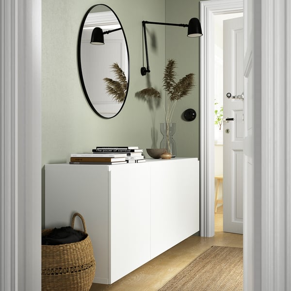 White BESTÅ wall-mounted cabinet, airy with adjustable shelves.