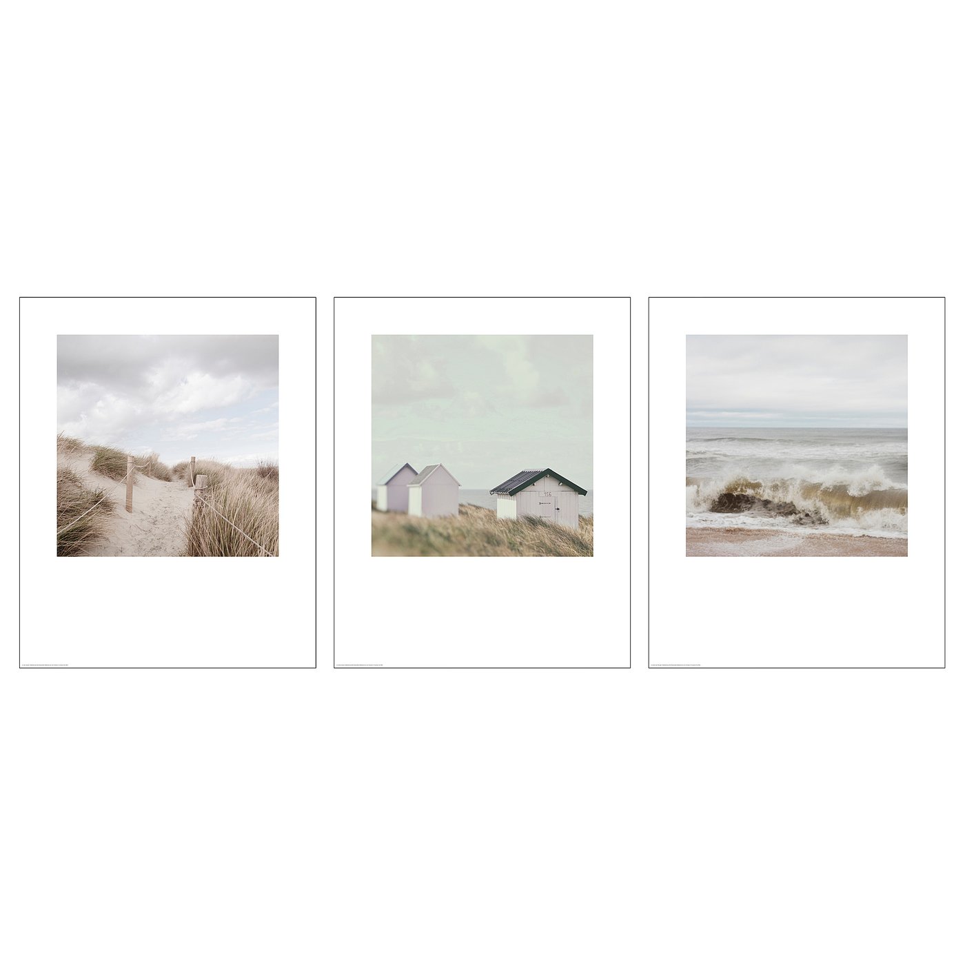 Three framed beach scenes in white frames. Left: golden sands, middle: pink beach huts, right: waves crashing.