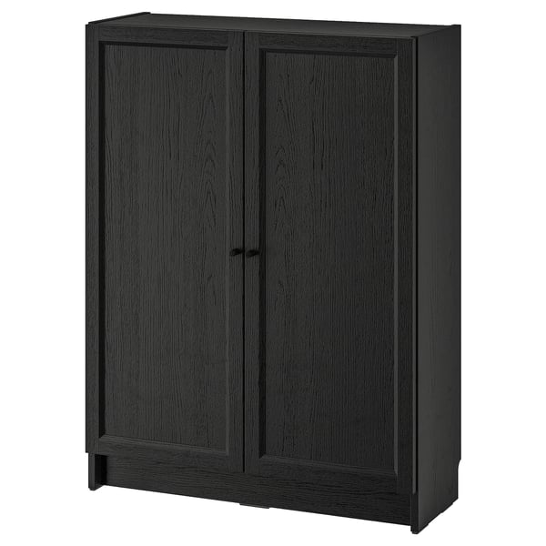 Black BILLY bookcase with two panel doors, rectangular, minimalist design for storage.