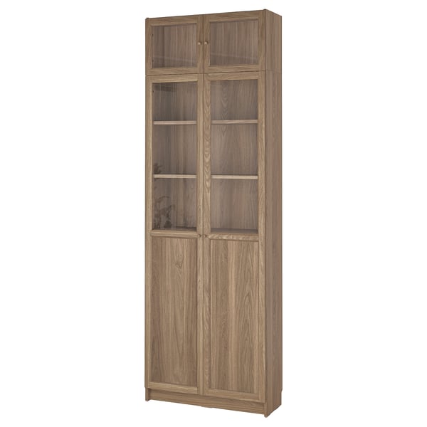 A BILLY bookcase with glass doors, 4 adjustable, 2 fixed shelves. Modern wooden design.