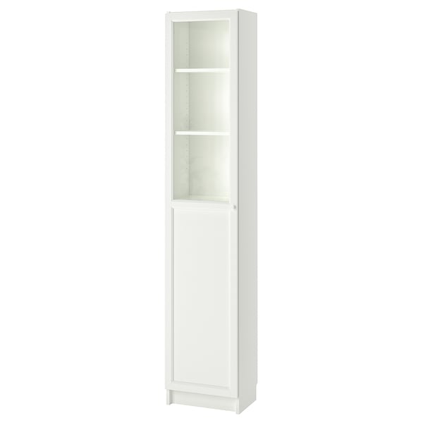 A white BILLY bookcase with glass doors, featuring a simple and timeless design. It stands upright with adjustable and dust-free storage compartments.