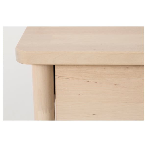 Wooden furniture close-up: smooth, light-colored tabletop and side panel detail. Craftsmanship with fine finish and natural wood grain.