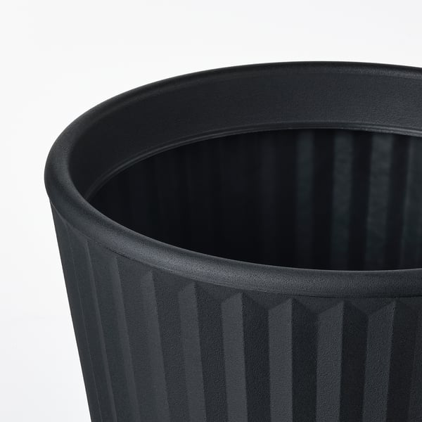 Black cylindrical planter with vertical grooves. High-quality polyethylene plastic. Drain hole visible at bottom.