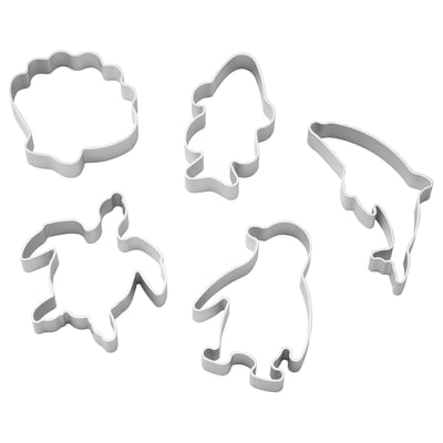 Five silver cookie cutters in shapes of turtle, penguin, fish, dolphin, and clam. Perfect for creating ocean-themed treats.
