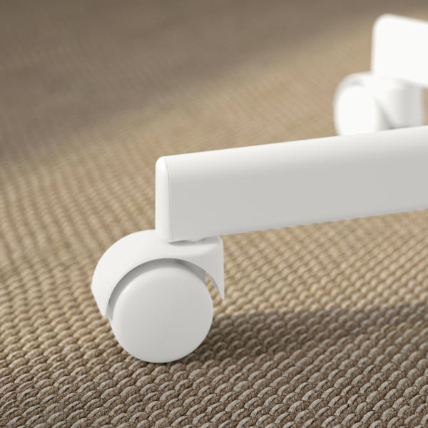 Close-up of a white office chair wheel on textured carpet, showcasing its quality and design.