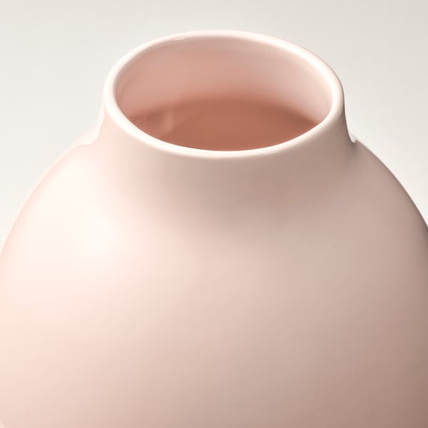 Large pastel pink vase, smooth surface, narrow neck, round shape.
