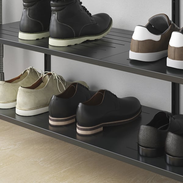Mens shoe rack with multiple shelves on wooden floors.