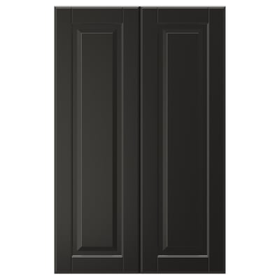 Two black BODBYN cabinet doors, featuring a smooth lacquered finish and a classic bevelled panel design.