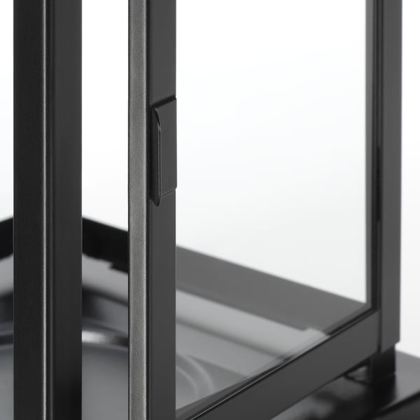 Black metal-framed lantern with sleek, modern design; durable powder coating ensures quality and longevity.