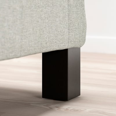 A modern bed leg, black, supportive and stylish.