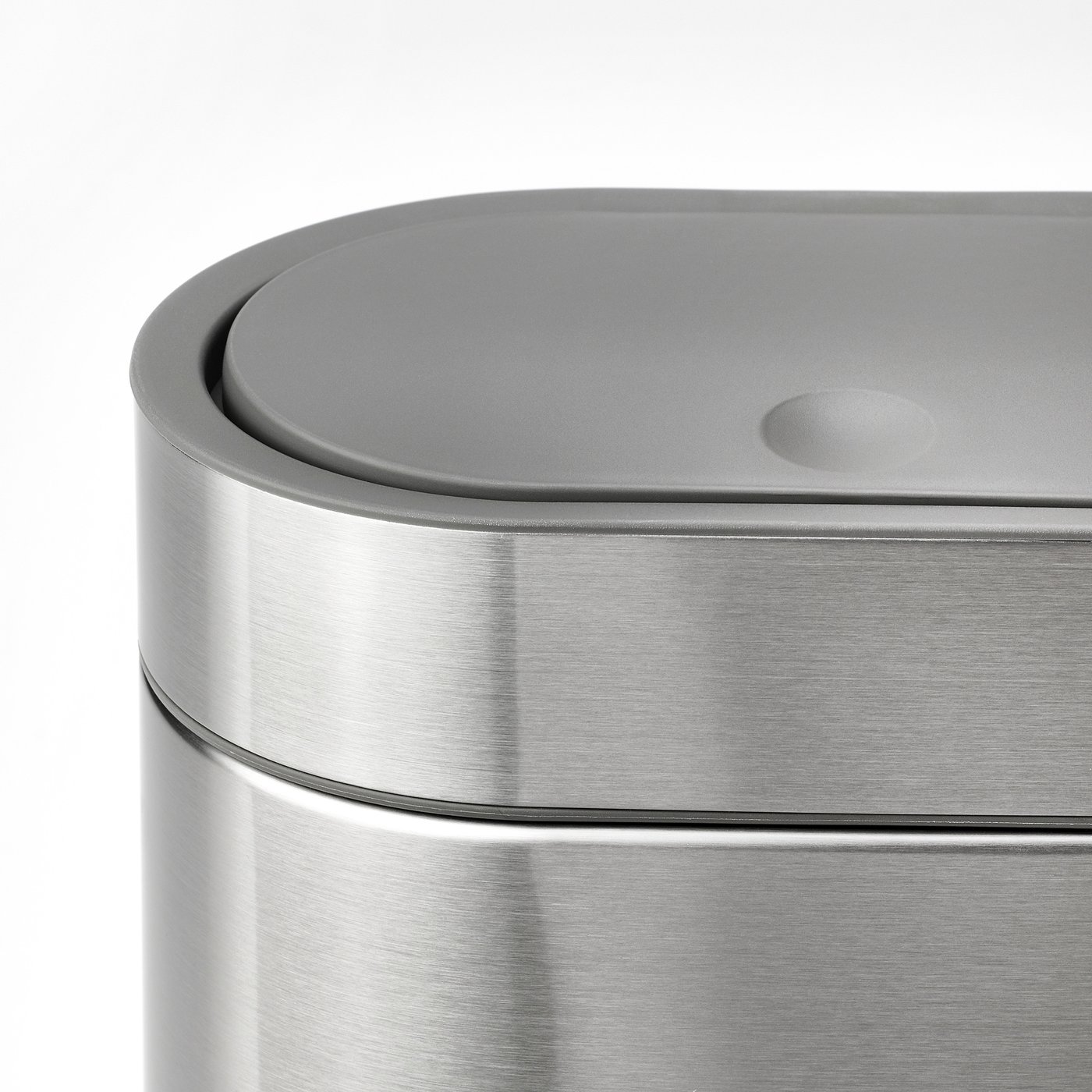 Closable stainless steel rubbish can with smooth, fingerprint-proof surface.