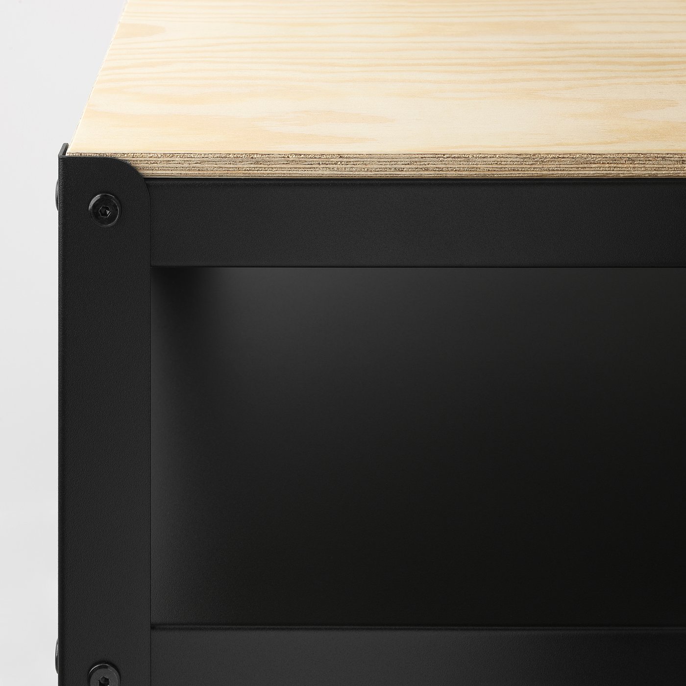 Close-up of BROR workbench showing sturdy black metal frame and thick wooden top.