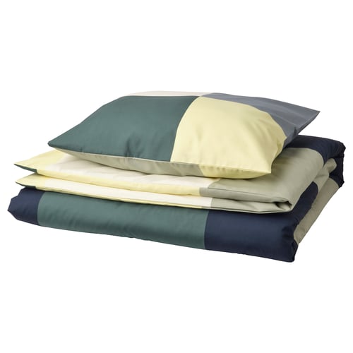 Colourful bedding set with green, yellow, and grey chequered pattern, folded neatly.