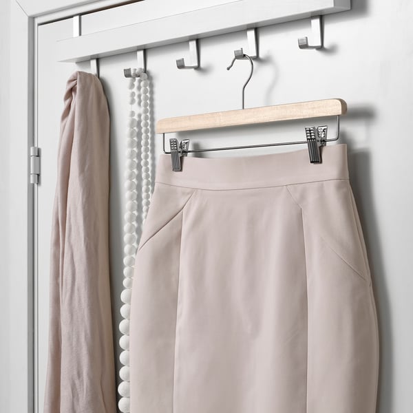 Adjustable hanger for skirts/pants, keeps clothes neat & wrinkle-free.